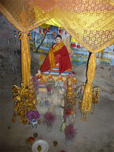 buddha shrine inside one of kampot's caves